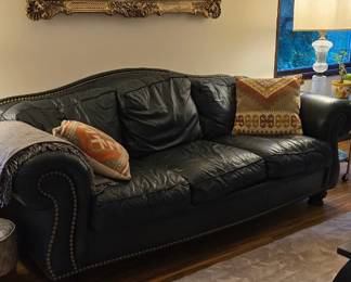 Leather couch and pillows