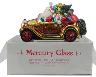 2505 - Mercury Glass Driving the NP Express Ornament (Description): Mercury Glass "Driving the NP Express"  ornament featuring Santa in a car.  Handpainted. Measures 5.5 inches.