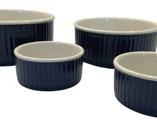 919 - 4 Piece Blue Ramekin Set 8"x2" (Description): Feature a deep cobalt blue ribbed exterior  with a cream-colored interior and rim. The  largest pieces measure 8 inches in diameter  by 2 inches tall.