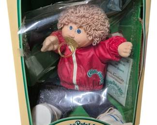 4158 - Cabbage Patch Kids Milton Richard Doll (Description): Cabbage Patch Kids doll named Milton Richard.  The doll comes in its original box with  birth certificate and adoption papers.  Features the classic Cabbage Patch Kids  styling with soft sculpture design.