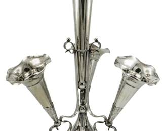 713 - Vintage Silver Plate Epergne 15.5" (Description): Vintage silver plate epergne featuring a  central trumpet vase flanked by four smaller  removable posy vases, all with scalloped  rims. The piece rests on a shaped base with  decorative scroll feet. Measures 15.5 inches in height.