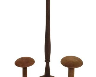 2784 - 3 Vtg Wig Stands 1 Wood 2 Velvet Covered 24" (Description): Collection of three vintage wig stands. One  is made of turned wood with a dark finish,  standing 24 inches tall with a rounded top  and circular base. The other two are shorter  stands covered in brown velvet with mushroom-shaped tops and circular bases. All  three display the warm patina of age  consistent with early to mid-20th century  millinery shop displays.
