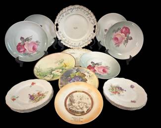 468 - Group Lot of Porcelain Plates (Description): A group lot of porcelain plates featuring  various decorative designs. The collection  includes plates with floral motifs and  assorted patterns. No measurements recorded.