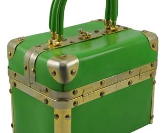 1774 - Delill Trunk Handbag Green 6"x8"x5" (Description): Delill trunk handbag in green featuring a  structured box silhouette with metal hardware  accents. Measures 6 inches by 8 inches by 5  inches.