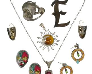 1956 - Assorted Sterling Jewelry 2.04oz (Description): A collection of assorted sterling silver  jewelry pieces weighing 2.04 ounces total.  The lot includes various decorative items  showcasing different styles and designs.