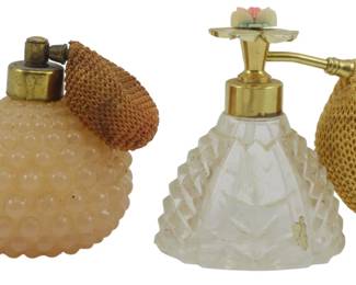 862 - Vintage Atomizer Perfume Bottles 3.5" (Description): Two vintage perfume bottles with atomizer  bulbs. Each bottle features decorative glass  design with gold-tone hardware. Measures 3.5  inches.