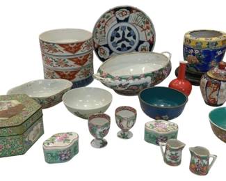 1205 - Assorted Oriental Porcelain Bowls & Items (Description): The grouping includes a variety of pieces  featuring traditional Asian motifs and  designs including a large Imari-style  planter, blue and white plate, famille rose  egg cups, covered boxes, small vases, bowls with turquoise interiors, and various  hand-painted vessels in polychrome enamels.  Styles include Chinese export, Japanese  Imari, and famille rose patterns with floral  and figural decoration.