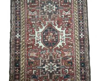 470 - Hand Knotted Persian Heriz Rug 24.5"x35" (Description): Handwoven Oriental rug featuring traditional  geometric patterns and a central medallion  design. The rug displays classic  craftsmanship with decorative borders and  fringed edges. Measures 24.5 inches by 11 inches.