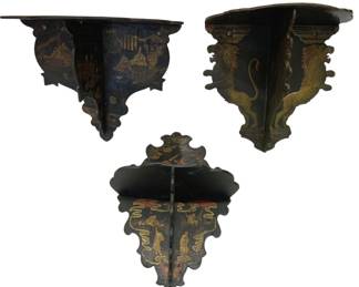938 - 3 Antique Painted Chinoiserie Wall Shelves (Description): A group of three antique wall bracket shelves  featuring hand-painted chinoiserie and  heraldic decoration on black lacquered wood.  One shelf displays figural scenes in the  traditional Chinese style, another features rampant lions in gold, and the third depicts  figures with gilt and polychrome details.  Each shelf has a shaped backplate with  scalloped edges and a projecting display  surface.