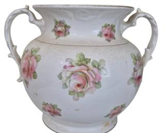 1281 - Vtg White Ceramic Urn Vase w/ Pink Roses (Description): Vintage white ceramic urn-style vase  featuring hand-painted pink rose decorations  throughout. The piece has a bulbous body with  an elegant flared rim and decorative  scrolled handles on each side. The vase sits on a footed base and displays charming  Victorian-style floral motifs. Measures 11" x  11". Chip on edge