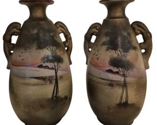 3929 - Japanese Double Handle Painted Vases 10" (Description): Pair of oriental vases featuring hand-painted  landscape scenes with trees and sunset sky.  The vases have an earthen, matte finish with  subtle color accents in pink, purple, and  ochre tones. Measures 10 inches tall.