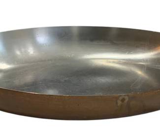 653 - Paul Revere Limited Edition Copper Pan (Description): Paul Revere copper pan with brass handles and  stainless steel interior. This classic  cookware piece features the distinctive Paul  Revere design known for quality  craftsmanship. Measures 1.75 inches in height, 14 inches in length, and 8.5 inches  in width