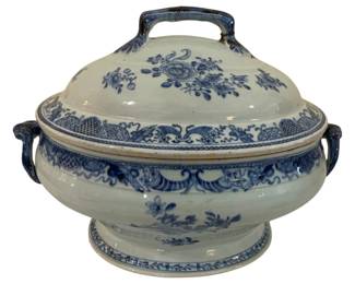 293 - Blue & White Porcelain Tureen w/ Lid (Description): Blue and white porcelain tureen with lid  featuring floral and decorative motifs. The  covered tureen has side handles and a loop  handle on the domed lid. The handle has been  repaired. Measures 10" x 16".