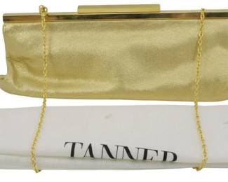 1827 - Tanner Evening Clutch Bag w/ Storage Bag (Description): Tanner evening clutch bag with storage bag.  The clutch features a gold-tone frame and  chain strap. Measures 5 inches by 11 inches  by 2 inches. Comes with original Tanner dust  bag for storage.