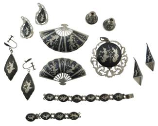 1954 - Assorted Siam Sterling Jewelry 2.50oz (Description): Assorted Siam sterling jewelry collection  with a total weight of 2.50 ounces. The lot  includes various pieces featuring traditional  Thai Niello work with dancer motifs.