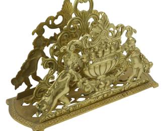 1871 - Vintage Japanese Brass Letter Rack 7"x11"x5" (Description): Vintage Japanese brass letter rack featuring  ornate openwork design with decorative  scrollwork and figural elements. The piece  displays intricate Baroque-style  ornamentation with a central urn motif flanked by elaborate flourishes. The  rectangular base is finished with a textured  geometric pattern and rests on small bracket  feet. Measures 7" x 11" x 5".