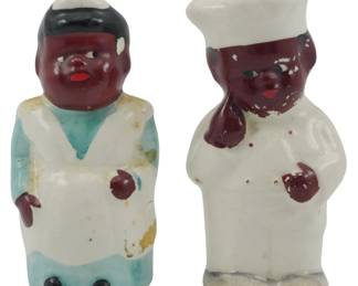 1707 - Pr Vtg Black Americana Shakers Marked Japan (Description): A pair of vintage Black Americana salt and  pepper shakers marked "Japan." These  collectible ceramic figural shakers depict  chef characters in traditional kitchen  attire. Each shaker measures 3 inches in height.