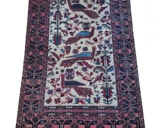 2801 - Hand-Knotted Persian Style Rug w/ Peacocks (Description): Hand-knotted Persian style rug featuring a  cream-colored central field decorated with  peacocks, birds, trees, and floral motifs.  The design includes multiple stylized  peacocks in brown and blue tones surrounded by smaller birds and botanical elements. The  rug has multiple decorative borders in pink,  navy blue, and dark burgundy with traditional  geometric patterns. Measures 70" x 38".