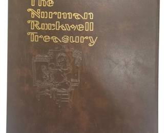 4203 - The Norman Rockwell Treasury Book (Description): The Norman Rockwell Treasury, 1979, a  comprehensive volume dedicated to the works  of the celebrated American illustrator. This  edition features a brown leather style cover  with gold embossed lettering and a decorative embossed illustration of Rockwell at his  easel on the front cover.