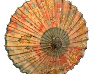 1323 - Bamboo Frame Oriental Umbrella 22" (Description): Oriental umbrella with wooden handle and  leather cord wrist strap. Features a bamboo  frame with painted decorative elements in  muted tones of red, green, and natural tan.  The umbrella is in closed position with a decorative metal or wood finial at the tip.