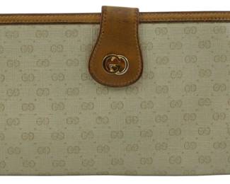1791 - Vintage Gucci GG Monogram Wallet 4.5"x7.5" (Description): Vintage Gucci wallet featuring the iconic GG  monogram pattern. The wallet is trimmed with  tan leather and features the classic  interlocking GG logo hardware on the front  closure tab. Measures 4 1/2" x 7.5".