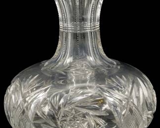 141 - American Brilliant Cut Glass Water Bottle 7" (Description): American Brilliant Cut Glass water bottle  featuring intricate cut patterns. Measures 7  inches.