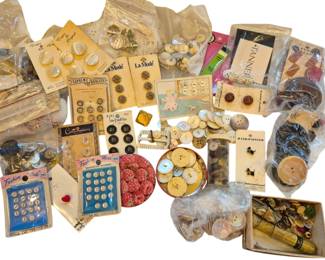 1452 - Vtg Button Collection on Cards & Loose (Description): Vintage button collection featuring a variety  of buttons both on original cards and loose.  The assortment includes buttons from various  brands including La Mode, La Petite,  Costumakers, Fashion Mode, and others. Materials include mother of pearl, plastic,  metal, and fabric-covered varieties in  assorted sizes and colors. Many buttons  remain on their original retail cards with  pricing, while others are grouped in small