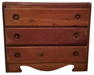 3719 - Antique Pine Three Drawer Small Chest (Description): A small antique pine chest of drawers  featuring three drawers with carved wooden  knob pulls. The piece displays a warm  reddish-brown finish with visible wood grain  and a shaped apron base. Measures 17 inches wide by 20 inches tall by 8 inches deep.