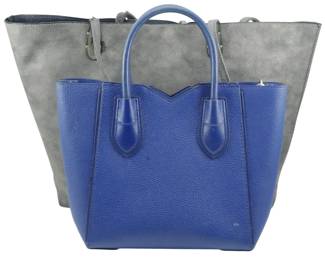 1799 - Michael Kors Pebbled Leather Tote w/ Storage (Description): Michael Kors pebbled leather tote bag with  storage bag included. Measures 8 inches by 12  inches by 4 inches.