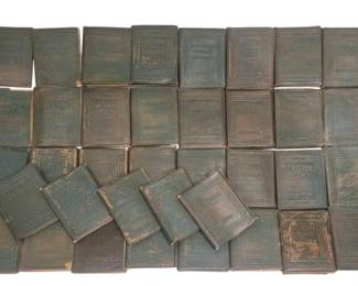 4199 - Little Leather Library Miniature Books (Description): A collection of Little Leather Library  miniature books featuring green leather-bound  covers with embossed decorative designs.  These small format books were popular in the  early 20th century and feature classic literary works. The bindings show  age-appropriate wear consistent with vintage  books from this era.