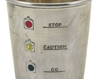 704 - Alvin Co. Sterling Silver Shot Glass (Description): Alvin Co. sterling silver shot glass  featuring an enameled traffic light motif  with red, yellow, and green signals marked  Stop, Caution, and Go. Measures 2.5 inches  tall and weighs 1.21 oz.