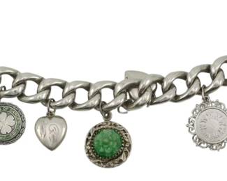 1938 - Vtg Charm Bracelet Assorted Sterling/Silver (Description): Vintage charm bracelet featuring assorted  sterling and silver contents. The bracelet  displays multiple decorative charms including  hearts, a four-leaf clover, and ornate  filigree designs. Total weight 2.04oz.
