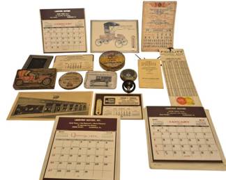 2751 - Vintage Advertising Collectibles & Calendars (Description): Group of vintage advertising collectibles  including wall calendars from Lakeview  Motors, automotive-themed thermometers, tin  containers, pocket mirrors with antique car  imagery, a 1947 football schedule from Fidelity, business cards, and various  promotional items. The collection features  early 20th century automobile illustrations  and spans several decades of American  advertising ephemera.