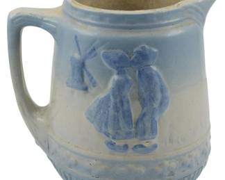 1865 - Early 1900s American Stoneware Pitcher 7" (Description): Early 1900s American stoneware vase featuring  a blue and white glaze with molded  decorative elements. Measures 7 inches.