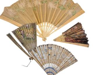 1447 - Vtg Decorative Paper Hand Fans (Description): A collection of vintage paper hand fans  featuring various decorative designs. The  fans include floral painted motifs in muted  tones of cream, green, purple, and blue, with  ornate detailing on the leaf portions. The collection showcases different styles of  folding fans with carved and decorated sticks  and guards, representative of late 19th to  early 20th century craftsmanship. Fans show  age appropriate wear.