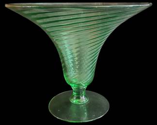 169 - Federal Glass Uranium Green Swirl Vase (Description): Federal Glass green swirl vase featuring a  flared trumpet-shaped body with distinctive  spiral ribbing, resting on a footed base.  Measures 7 inches by 8.5 inches.