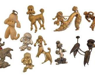 1479 - Vtg Dog Pins & Necklace Pendants Collection (Description): A collection of vintage dog pins and necklace  pendants featuring various breeds including  poodles, dachshunds, terriers, and other  canine designs. The pieces display a variety  of finishes including gold tone, silver tone, and antiqued metal, with some featuring  rhinestone or glass accent eyes. Styles range  from whimsical to naturalistic  representations.
