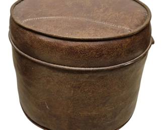 4134 - Brown Leather Look Round Foot Stool 12"x15" (Description): A round foot stool with a distressed brown  leather-look finish. The stool features  stitched detailing.