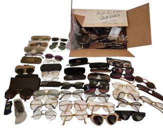 4026 - Group of Vtg Eye Glasses, Sunglasses & Cases (Description): A large collection of vintage eyeglasses,  sunglasses, and accessories. The assortment  includes various styles spanning several  decades, featuring wire-rimmed spectacles,  oversized fashion frames, cat-eye designs, and aviator-style sunglasses. The group also  includes multiple eyeglass cases in various  materials and styles. A diverse lot suitable  for collectors of vintage eyewear or  theatrical costume use.