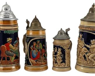 729 - 4 Assorted Vintage Beer Steins (Description): A collection of four assorted vintage beer  steins. The largest stein measures 9 inches  in height. Each stein features traditional  German-style ceramic construction with pewter  lids and decorative relief scenes.