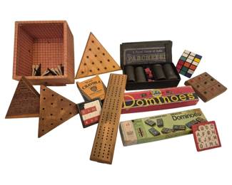 2737 - Group Vintage Games Dominoes Puzzles Etc (Description): A collection of vintage games and toys  including Hal-Sam Dominoes in original box,  Milton Bradley Colored Dot Dragon Dominoes, a  Royal Game of India Parcheesi set with cups  and dice, wooden peg board games including triangular jump puzzles, a No. 24Crayola  School Crayons box, a Rubik's Cube style  puzzle, wooden cribbage boards, a  Scrabble-style letter tile set, and a wooden  box containing pick-up sticks. A charming