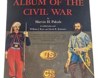4201 - Centennial Album of the Civil War Book (Description): Centennial Album of the Civil War by Marvin  H. Pakula in collaboration with William J.  Ryan and David K. Rothstein. This  commemorative volume depicts prominent  military and naval leaders, uniforms, regimental insignia and flags, weapons and  ammunition of both the Union and Confederate  forces. Features over 100 portraits and 20  pages of plates in full color. Measures 13.5"  x 11".