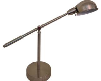 3786 - Adjustable Brushed Nickel Desk Lamp (Description): Adjustable desk lamp featuring a brushed  nickel finish. The lamp has a counterbalanced  arm design with a dome-shaped shade and sits  on a round weighted base. The articulating  arm allows for flexible positioning of the light source. Used as is electric/electronic/mechanical  item. No guarantee all components, untested.
