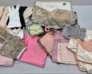 2858 - Vtg Ladies Accessories Lot Gloves Bags (Description): A lot of assorted vintage ladies accessories  including multiple pairs of formal gloves in  white, black, beige, and pink with decorative  beaded cuffs, various evening bags and  pouches in silk and satin with beaded and embroidered embellishments, a gold-toned  beaded collar or cape piece, delicate lace  pieces, embroidered handkerchiefs and linens  in pink and cream tones, a compact with  floral design, and other decorative textile