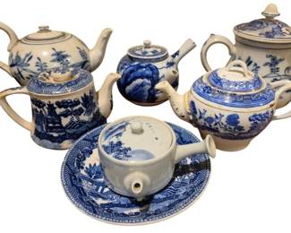 4186 - Blue & White Teapots Group Lot (Description): A group lot of blue and white teapots. This  collection features multiple teapots in  classic blue and white ceramic designs. Age  appropriate wear and damage.