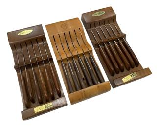 664 - Steak Knives 18 Total w/ Wood Block Holders (Description): Collection of eighteen steak knives presented  in three wooden storage blocks. The knives  feature wooden handles and are organized in  their original holders.
