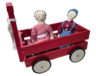 4165 - Wooden Wagon w/ Handmade Dolls (Description): A wooden wagon accompanied by handmade dolls.  The set features a charming combination of  folk-style craftsmanship, with the dolls  displayed within the wagon.