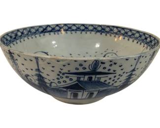 294 - Antique Blue & White Canton Porcelain Bowl (Description): Antique blue and white porcelain bowl in the  Canton style, featuring hand-painted  chinoiserie decoration with pagodas, trees,  and landscape scenes. The interior rim  displays a traditional geometric lattice border pattern. The bowl measures 11" x 10.