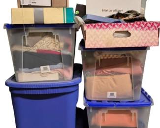 4099 - 14 Boxes Full of Fabric & Textiles (Description): A large lot of 14 boxes full of fabric and  miscellaneous textile items. The collection  is contained in various storage containers  including blue plastic bins with lids, clear  storage totes, cardboard boxes, and a shoe box. Contents appear to include assorted  fabric pieces, linens, and other textile  materials in various colors and patterns. An  excellent lot for crafters, quilters, or  anyone in need of fabric supplies.