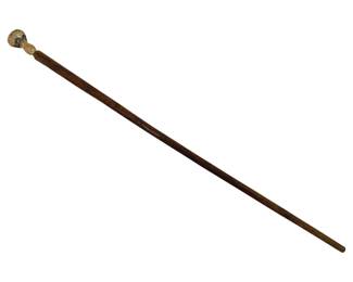396 - Carved Wooden Cane w/ Figural Handle 34.5" (Description): Carved wooden cane featuring an ornate  handle. The shaft displays decorative carved  patterns along its upper portion. Measures  34.5 inches in length.